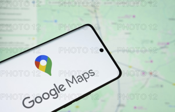 The logo of the google maps is displayed on a smartphone screen, and the website google maps is visible on a computer screen in the background