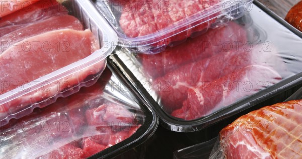 Composition with packages of assorted meat products