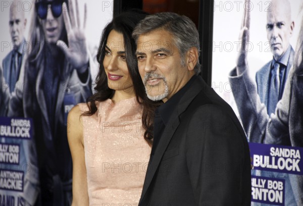 HOLLYWOOD, CA, USA, OCTOBER 26, 2015: Amal Clooney and George Clooney at the Los Angeles premiere of 'Our Brand Is Crisis' held at the TCL Chinese Theatre in Hollywood., Hollywood, California, USA, North America