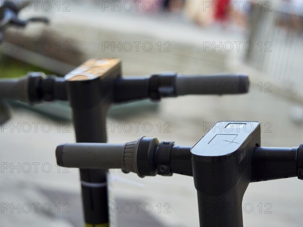 A picture of a detail of some electric scooter