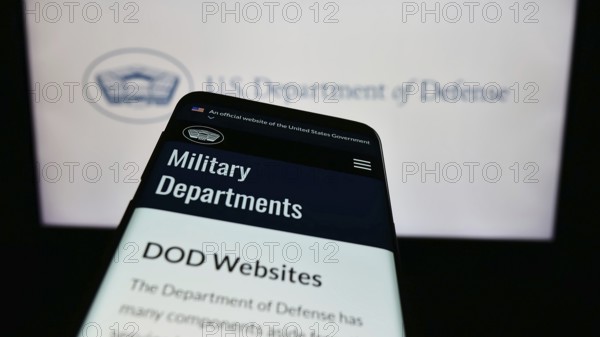 Stuttgart, Germany, 10-29-2023: Mobile phone with website of United States Department of Defense (DoD) in front of logo. Focus on top-left of phone display, Europe