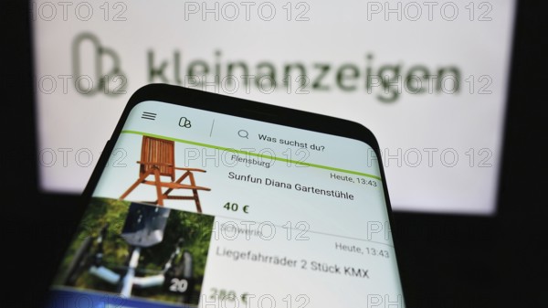 Stuttgart, Germany, 04-13-2024: Mobile phone with website of German classifieds platform company kleinanzeigen.de GmbH in front of logo. Focus on top-left of phone display, Europe