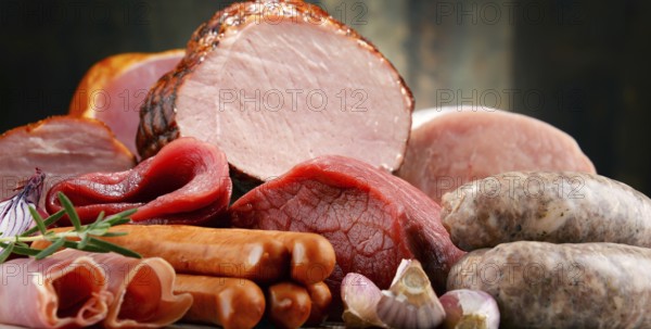 Assorted meat products including ham and sausages