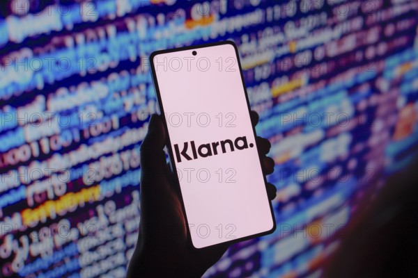 In this photo illustration, the Klarna Bank AB logo is displayed on a smartphone screen
