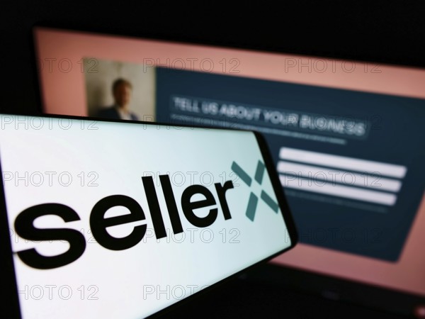 Stuttgart, Germany, 05-08-2022: Smartphone with logo of e-commerce company SellerX Germany GmbH on screen in front of business website. Focus on center of phone display, Europe