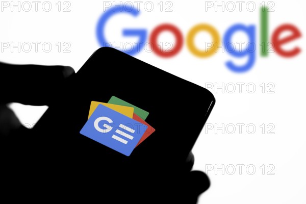 In this photo illustration the Google News logo is displayed on a smartphone.