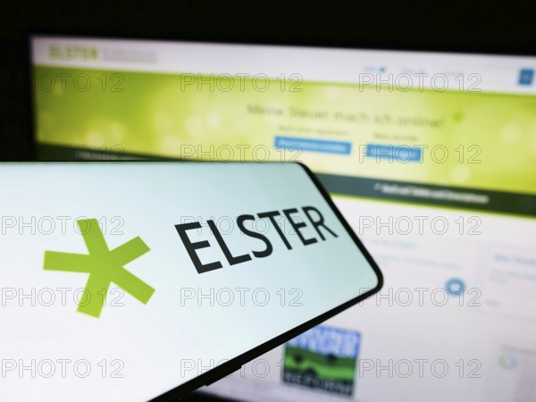Stuttgart, Germany, 10-15-2022: Cellphone with logo of German tax software Elster on screen in front of website. Focus on center-left of phone display, Europe