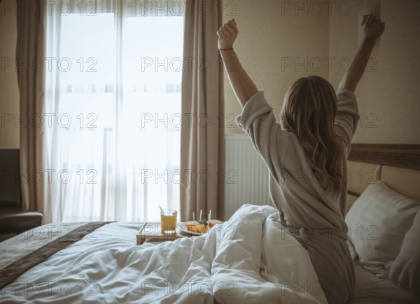 Rear view woman stretching body after awakening bed. Resolution and high quality beautiful photo