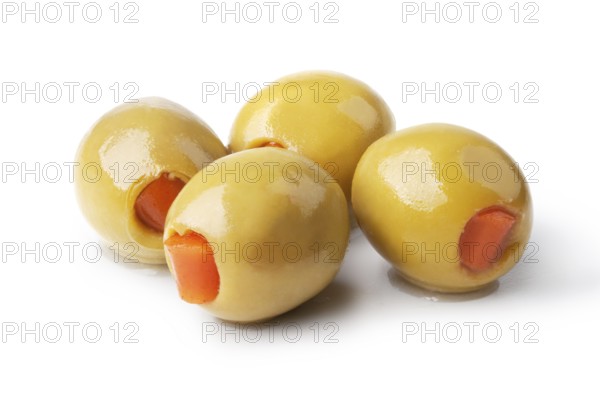 olives into bowls on wooden table