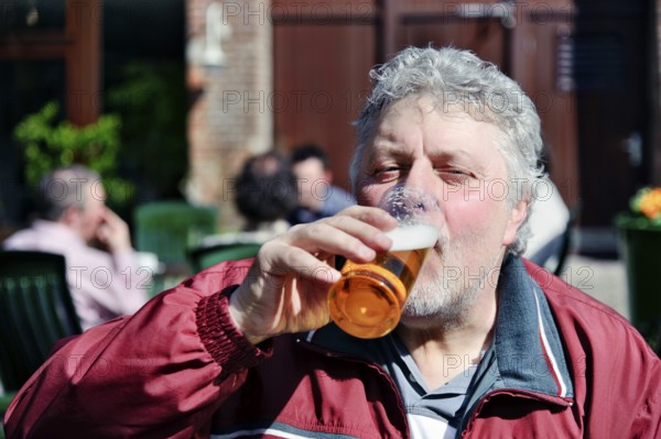Thirsty man drinks a beer