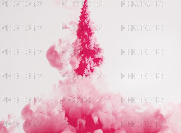 Bright ink drops dissolving underwater