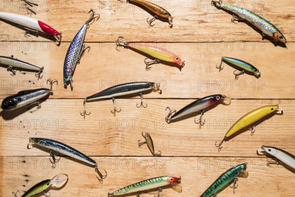 Colorful fishing lures wooden desk