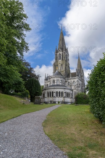 Cork, Ireland, 16 August, 2022: view of the Saint Fin Barre's Cathedral on the River Lee in downtown Cork, Europe