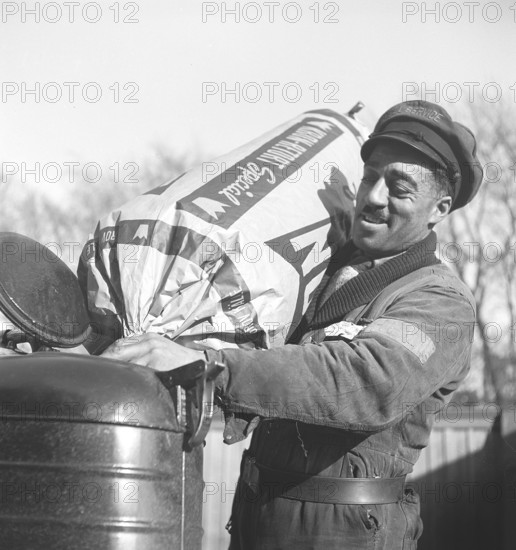 Wood gas 1945. A man at a Shell service station fills more coal into the container to fuel the wood gas unit of a lorry. A natural feature during these years during the World War II was the Wood gasification unit on cars and trucks. Wood gas is a gas that results from the incomplete combustion of wood or coal, and was used to power vehicles. The driver had to fill up the coal himself and make sure that the combustion functioned as it should. Due to a lack of fuel during the Second World War, wood gas played a major role in keeping transport running. Kristoffersson ref N50-3