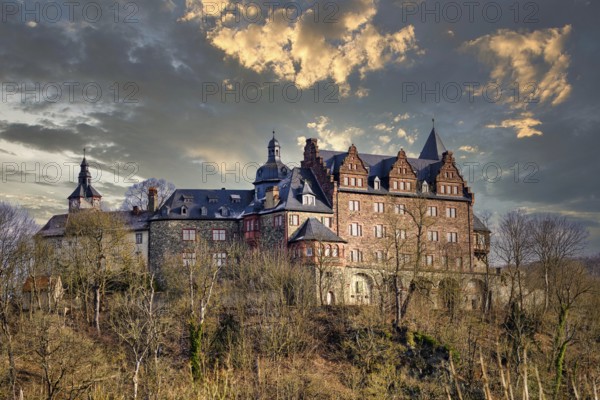 View of Rammelburg Castle near Mansfeld in the state of Saxony-Anhalt with a mystical sky