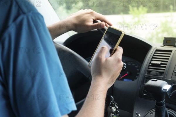 Photo of a man using smartphone while driving the car, transportation and vehicle concept with icon social media send email wifi chat read email