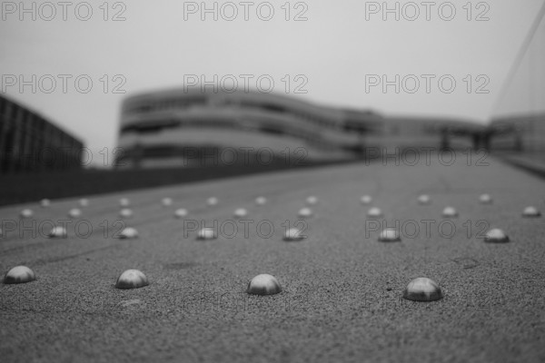 Path on the triangular meadow, accessible roof, blurred background, black and white, Düsseldorf, Germany, Europe