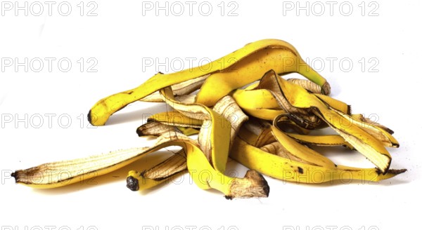 A pile of banana peels, organic fruit waste on a white background