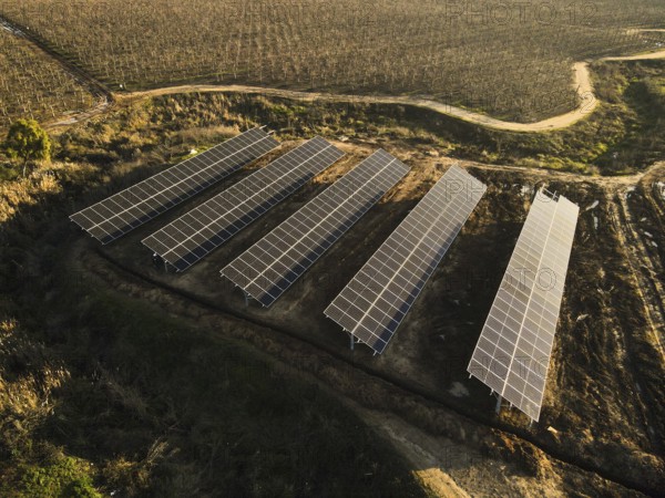 Aerial view of solar power plant solar panels on vineyard. Electric panels for producing clean ecologic energy