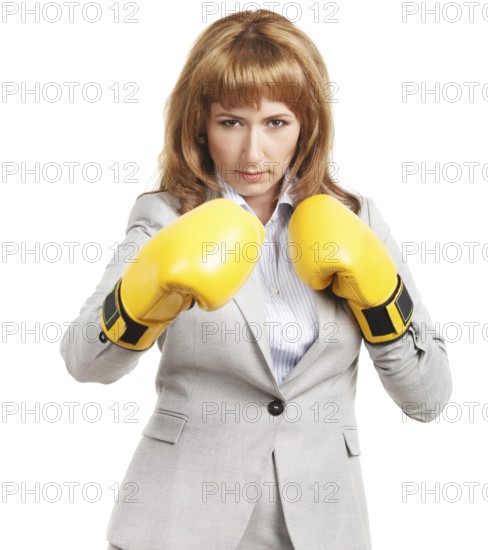 Portrait of a young businesswoman wearing boxing gloves