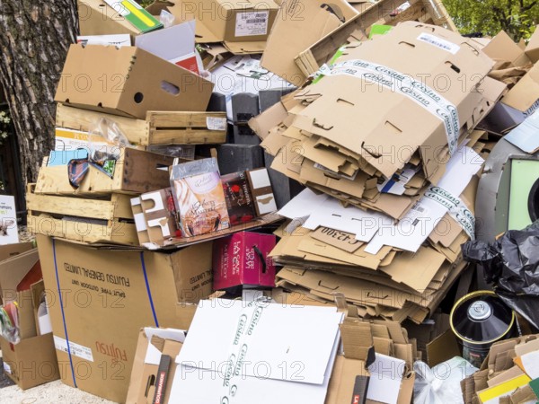 Mountains of cardboard on the street Waste paper from packaging is collected