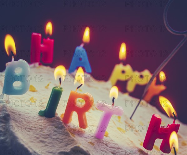 Retro Filtered Photo Of Children's Birthday Candles On A Cream Cake