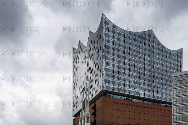 Hamburg, Germany, August 4, 2019: Elbphilharmonie or Elbe Philharmonic Hall in the HafenCity quarter. Designed by architecture firm Herzog de Meuron. Close up detail view, Europe