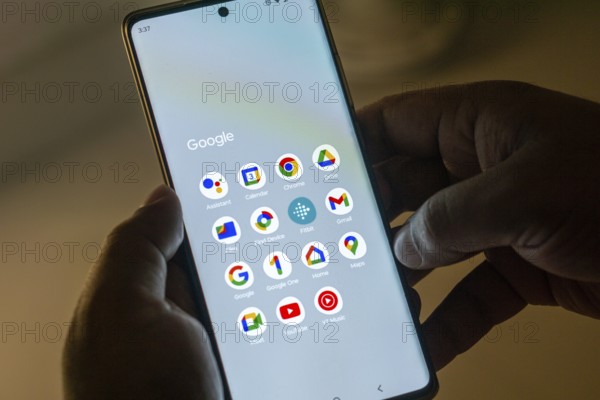 Google services (Google assistant, Calendar, Chrome, Drive, Gmail, Files, Find Device, Fitbit, Google, Google one, Home, Maps, Meet, YT Music, YouTube) icons apps on a screen smartphone. Google is the biggest Internet search engine in the world