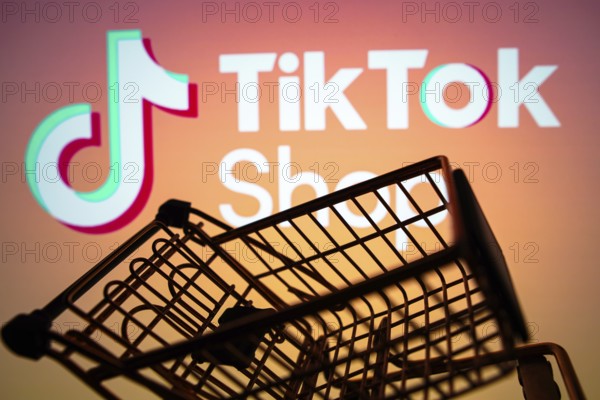 April 5, 2024, Brazil. In this photo illustration, the TikTok Shop logo seen displayed on a smartphone along with a shopping cart
