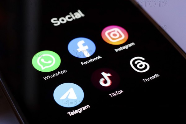 In this photo illustration, WhatsApp, Facebook, Instagram, Telegram, TikTok and Threads apps displayed on your smartphone screen