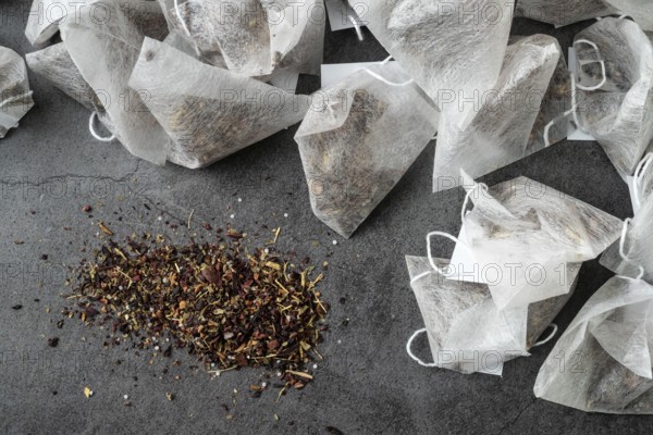 Pyramid tea bags on grey background