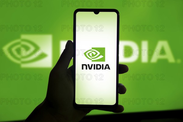 Dhaka, Bangladesh 11 Nov 2024: Nvidia logo on smartphone screen with AI in the background. Nvidia Corporation is an American multinational corporation and technology company.