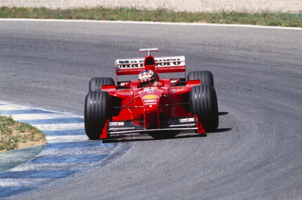 Formula 1 World Champion Michael Schumacher on the track in the Ferrari F399, German GP at the Hockenheimring, 1 August 1999