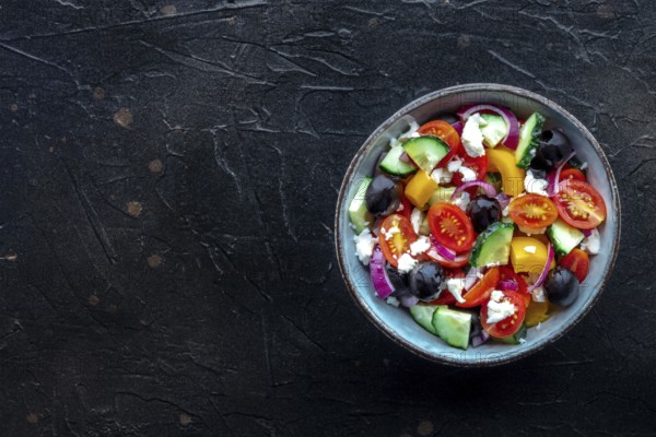 Greek salad. Fresh tomato, cucumber, bell pepper, Feta cheese, onion, and olives. Healthy summer food, overhead flat lay shot with a place for text, Food photography, Food photography