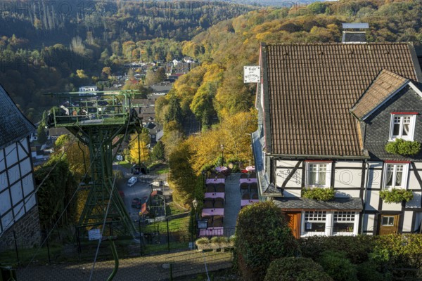 Autumn landscape with a view of a cable car and traditional village architecture, Burg Castle in Bergisches Land