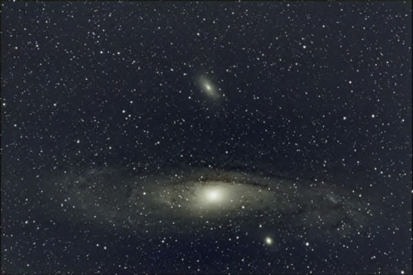 An impressive close-up of a large spiral galaxy (M 31, Andromeda Nebula) surrounded by countless stars in the deep night sky, Haibach, Lower Bavaria