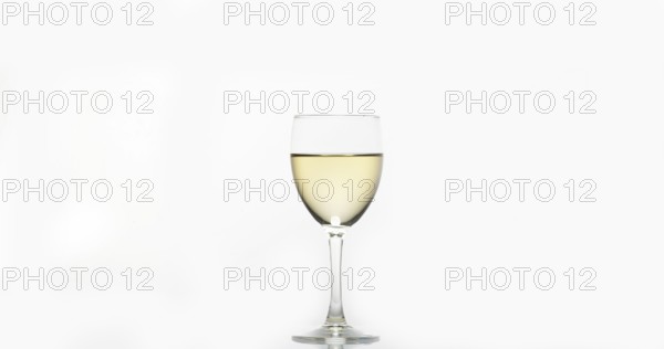 Glass of White Wine against White Background