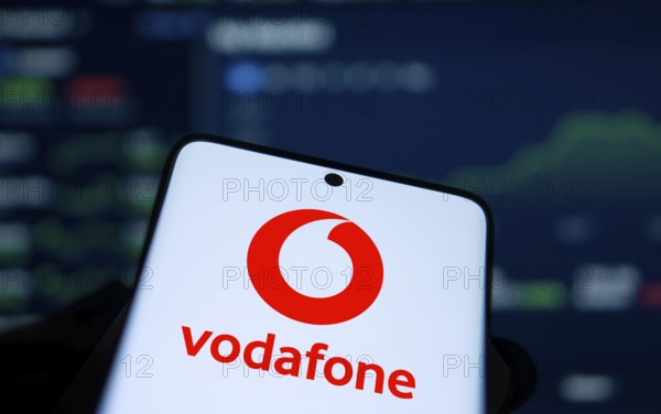 Vodafone logo is displayed on smartphone.