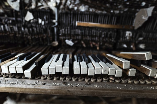 Detail of broken grand piano in mess hall of abandoned military base in Chernobyl Exclusion Zone of Alienation
