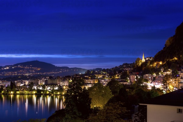 Switzerland, Montreux, cityscape dusk night view with Lake Geneva and Alps, Europe