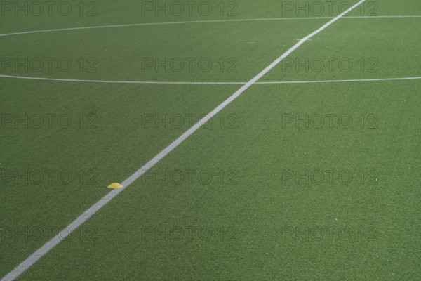 Partial image of green artificial turf in sports stadium