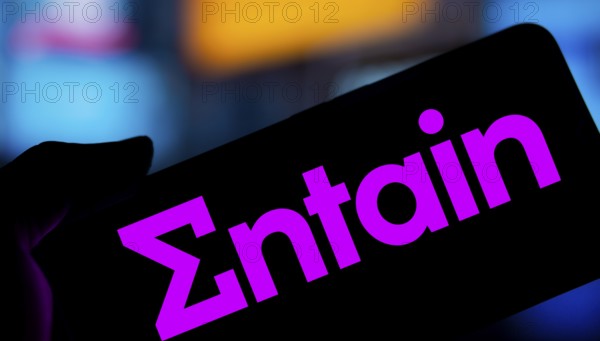 Dhaka, Bangladesh- 28 Nov 2024: Entain logo is displayed on smartphone.Entain plc is an international sports betting and gambling company