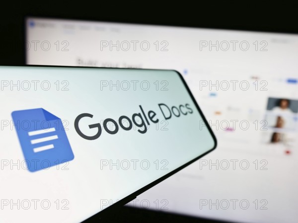Stuttgart, Germany, 09-23-2023: Mobile phone with logo of online word processing product Google Docs on screen in front of website. Focus on center-left of phone display, Europe