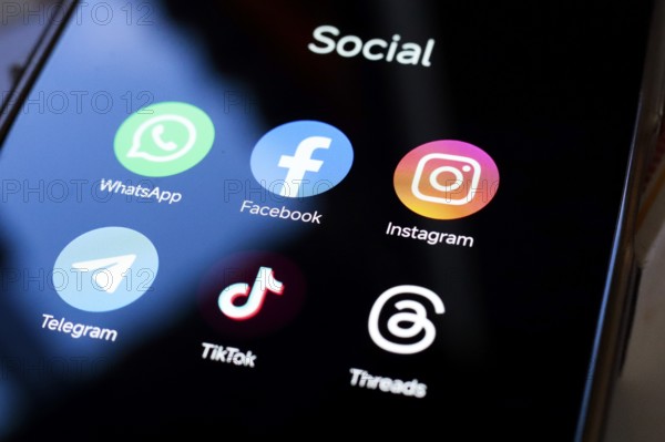 In this photo illustration, WhatsApp, Facebook, Instagram, Telegram, TikTok and Threads apps displayed on your smartphone screen