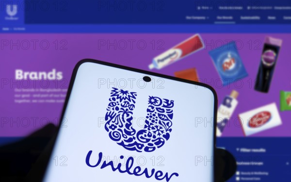 unilever logo is displayed on smartphone. Unilever PLC is a British multinational fast-moving consumer goods company