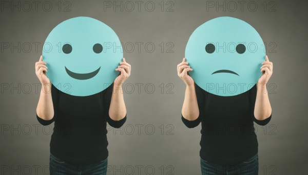 Head with a sad and a happy face, mental health concept, positive and negative mindset, depression, support and evaluation symbol, emotion