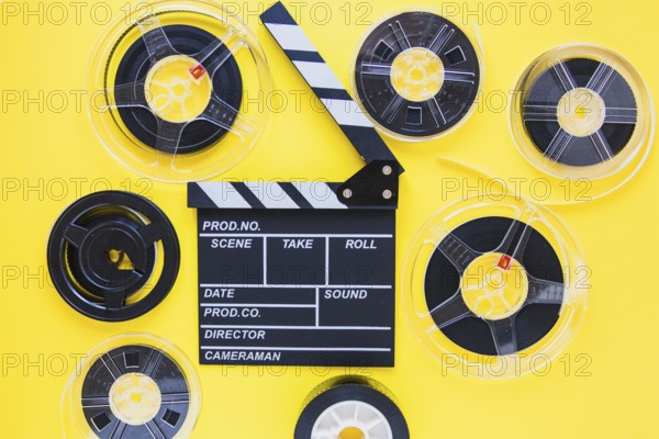 Arrangement film reels clapboard. Beautiful photo