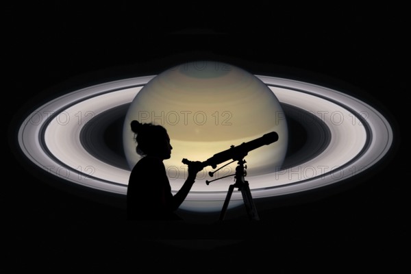 Girl looking at the stars with telescope. Saturn planet, isolated on black. Elements of this image are furnished by NASA