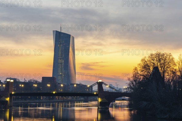 View across the Main to the ECB. Sunrise in the background of the buildings. Taken in the morning in Frankfurt am Main