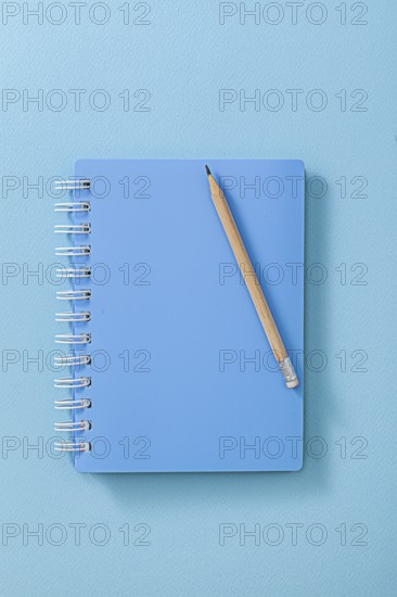 Blue Notepad With Wooden Pencil Close Up